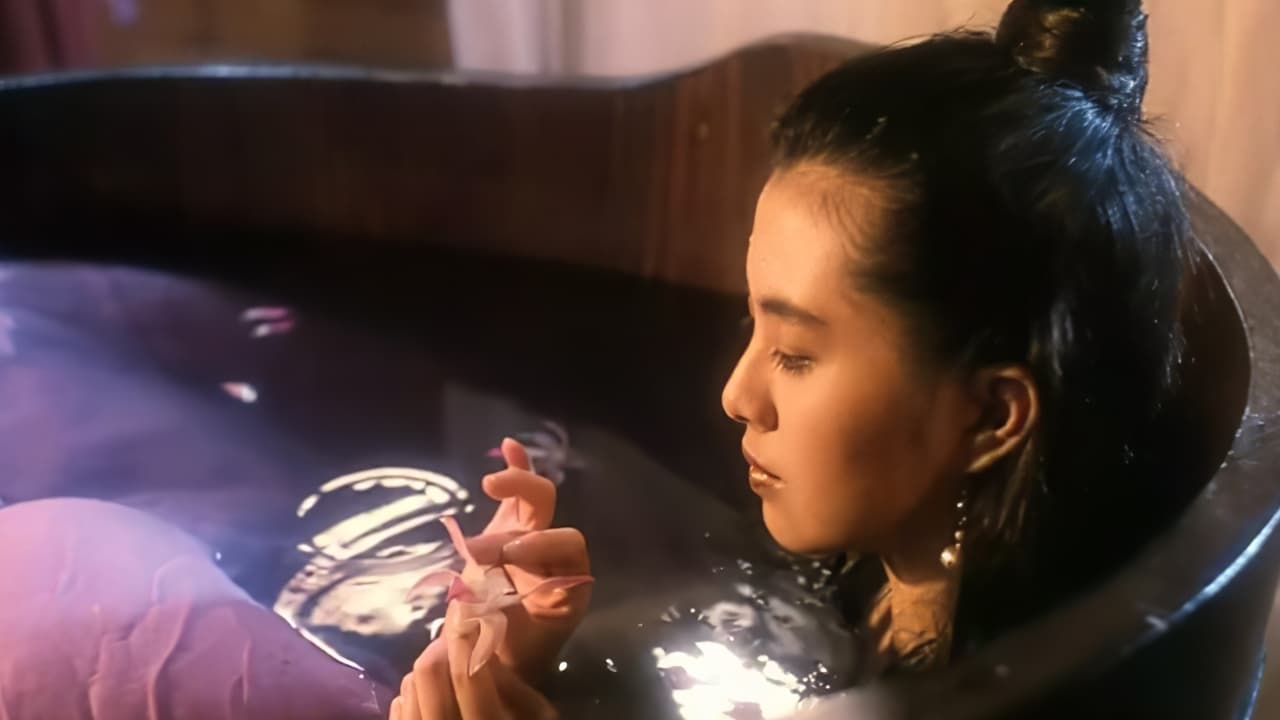 Screenshot from the film A Chinese Ghost Story. A woman soaks in a wooden tub while holding a pink flower. 