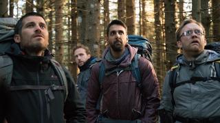 The four leads of The Ritual search the woods for answers