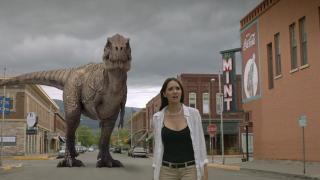 A T-Rex lurks in the distance in Cowboys vs. Dinosaurs